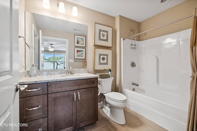 bathroom featuring toilet, visible vents, shower / washtub combination, and vanity