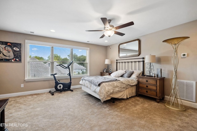 bedroom with carpet, visible vents, ceiling fan, and baseboards