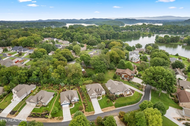 drone / aerial view featuring a residential view and a water view