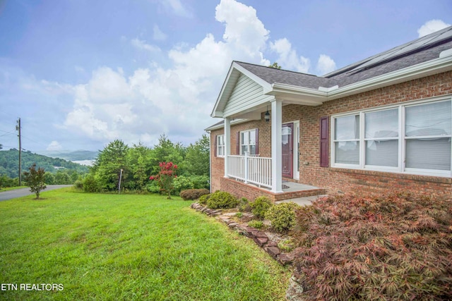 view of property exterior with a yard