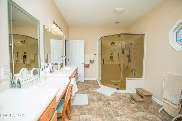 bathroom with vanity and an enclosed shower