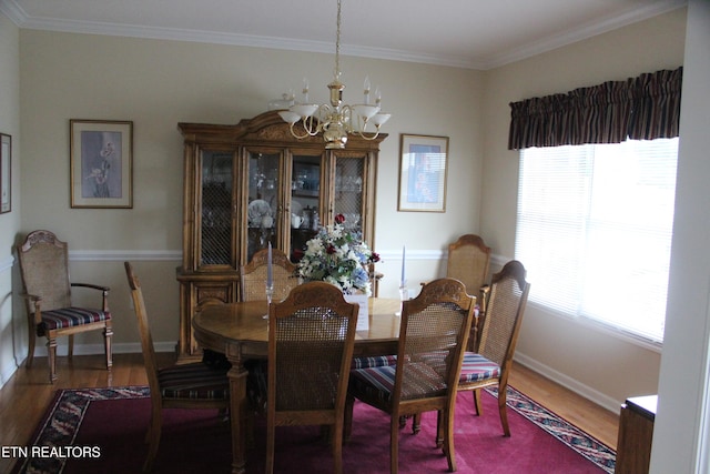 dining room featuring ornamental molding, dark wood-type flooring, and plenty of natural light