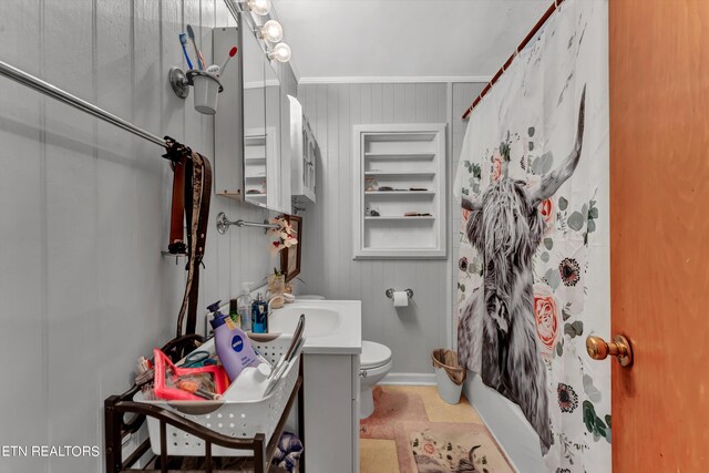 bathroom with vanity, crown molding, toilet, and tile patterned floors