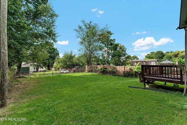 view of yard with a deck