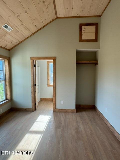 unfurnished bedroom featuring ornamental molding, wooden ceiling, lofted ceiling, and light hardwood / wood-style floors