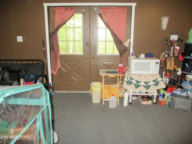 interior space featuring french doors and carpet floors