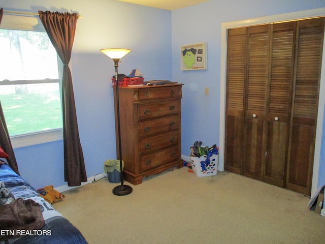 bedroom featuring a closet and carpet