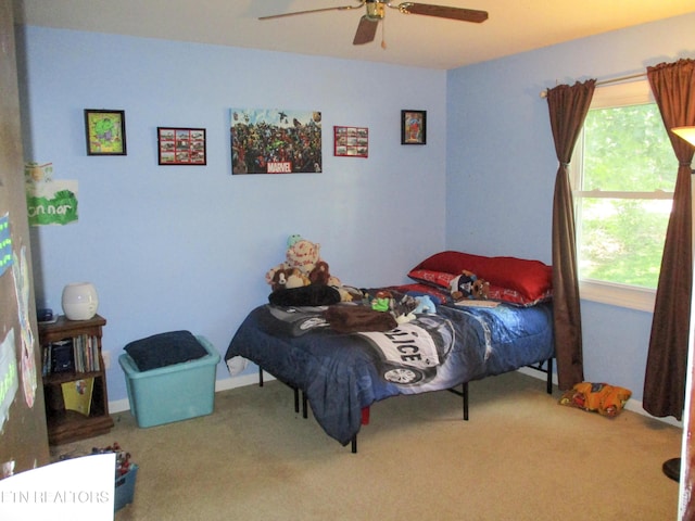 carpeted bedroom featuring ceiling fan
