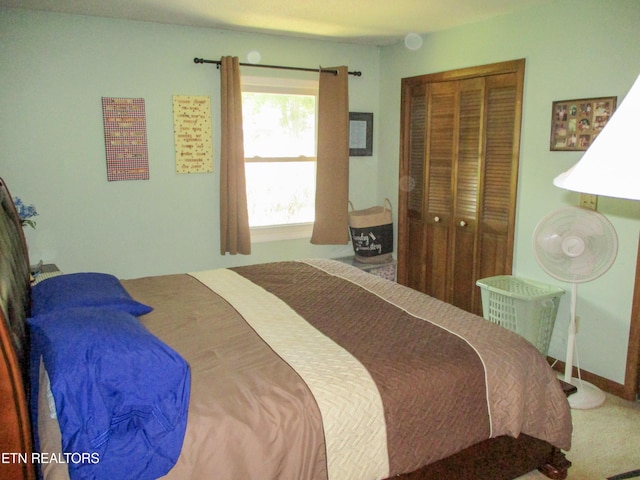 carpeted bedroom with a closet