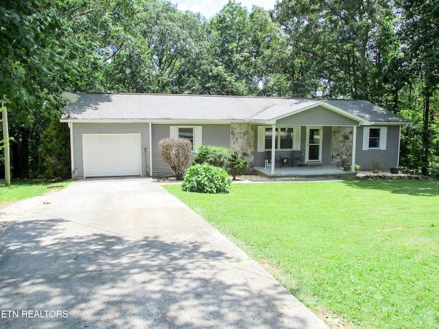 ranch-style house with a garage and a front yard