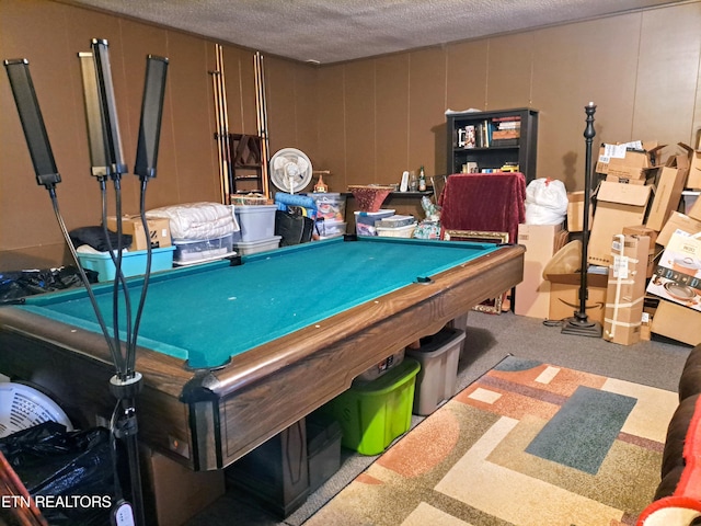 recreation room with pool table, carpet floors, and a textured ceiling