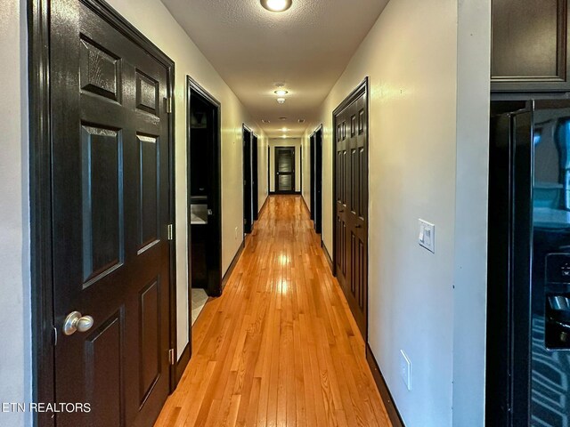 hallway featuring light hardwood / wood-style floors