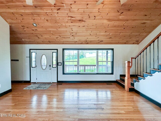 entrance foyer with high vaulted ceiling, wooden ceiling, and light hardwood / wood-style flooring