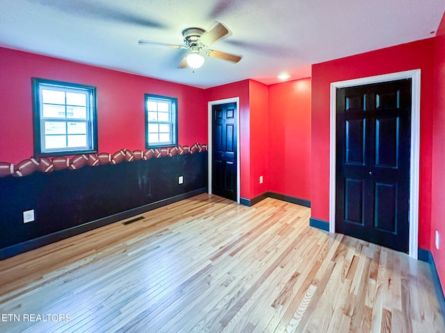 foyer entrance featuring light wood-type flooring and ceiling fan