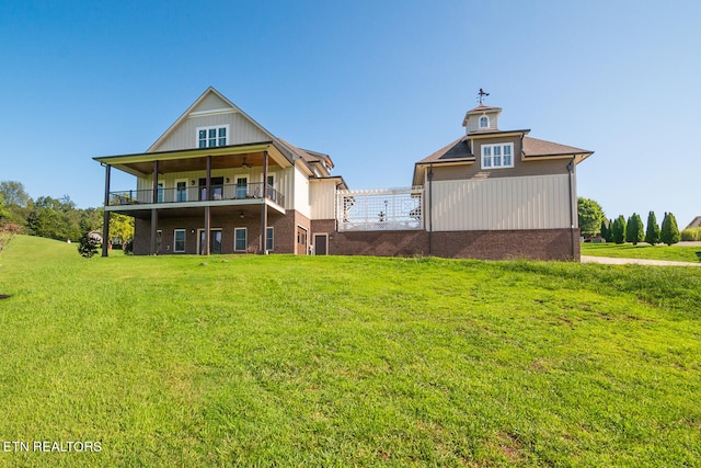 rear view of property featuring a yard