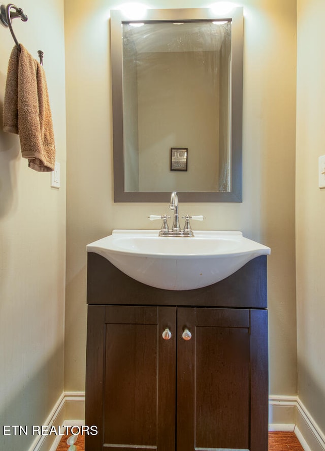 bathroom featuring vanity and baseboards