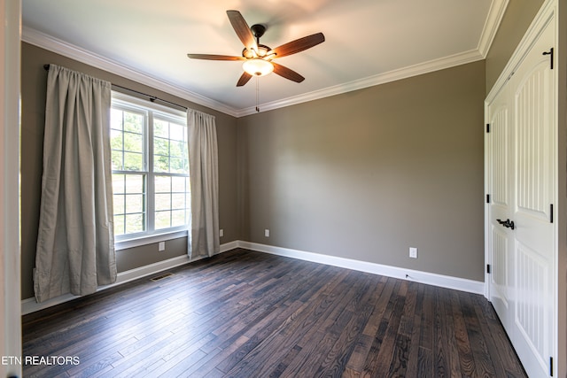 unfurnished room with dark wood-type flooring, ceiling fan, and ornamental molding