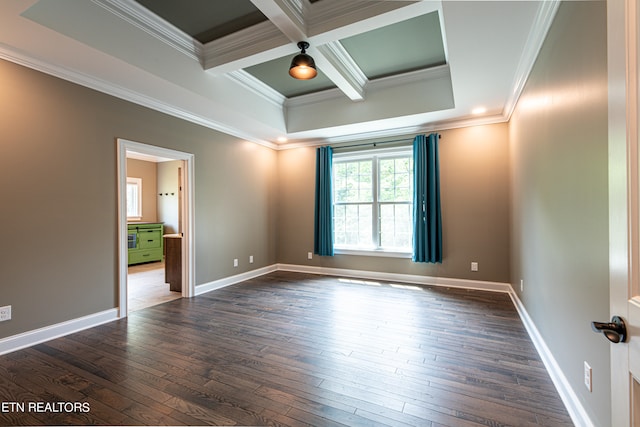 spare room with dark wood-type flooring, a tray ceiling, beamed ceiling, coffered ceiling, and ornamental molding