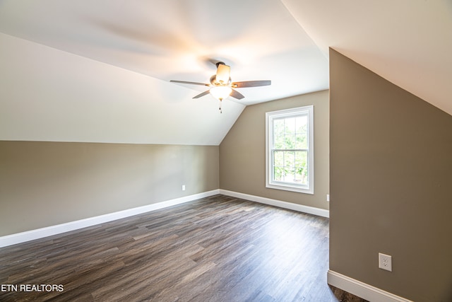 additional living space featuring lofted ceiling, hardwood / wood-style flooring, and ceiling fan