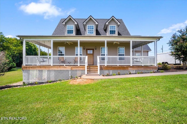 farmhouse featuring a front lawn and covered porch