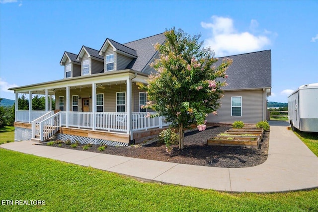 cape cod-style house with a porch and a front lawn