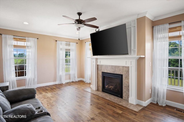 unfurnished living room featuring hardwood / wood-style floors and plenty of natural light