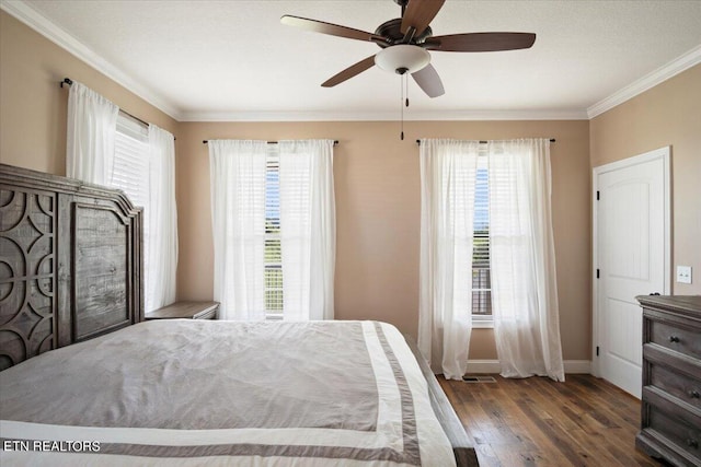 bedroom featuring wood-type flooring, ornamental molding, and ceiling fan