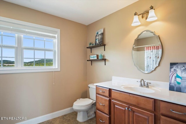 bathroom with tile patterned floors, toilet, and vanity