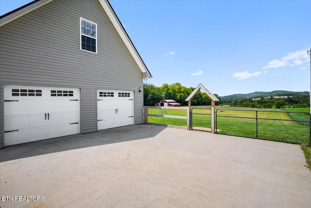 garage featuring a lawn