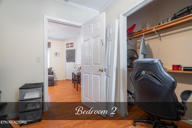 home office featuring crown molding and wood-type flooring