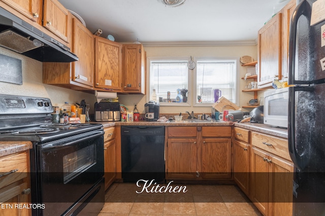 kitchen featuring sink, black appliances, and light tile patterned floors