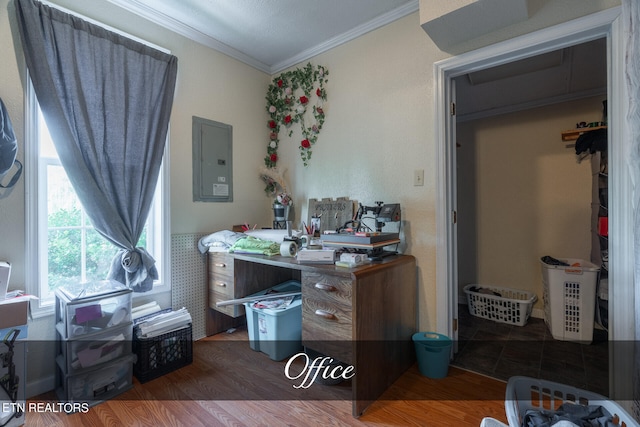 office area with dark hardwood / wood-style floors, electric panel, and ornamental molding