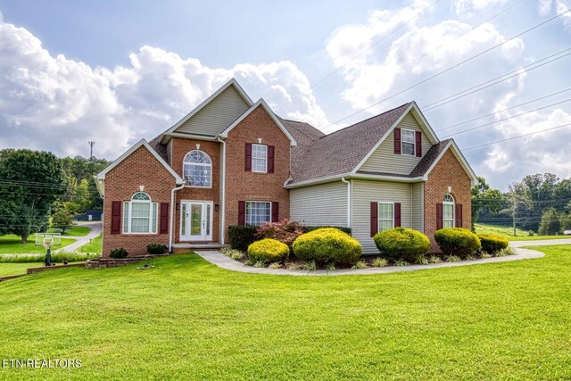 view of property featuring a front yard