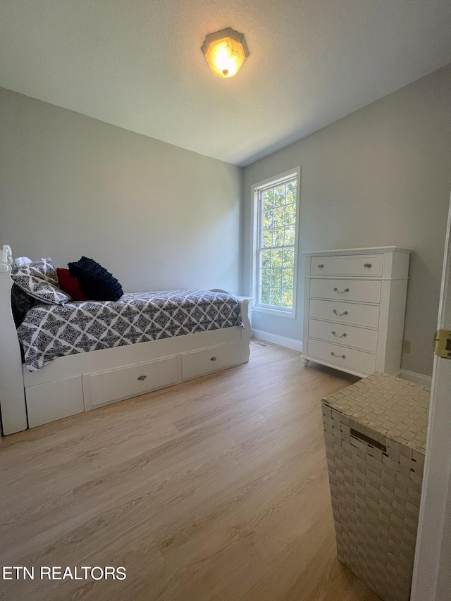 bedroom featuring light wood-type flooring