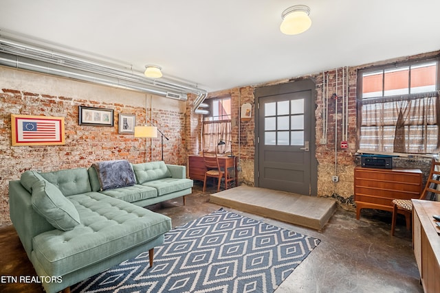 living room with brick wall