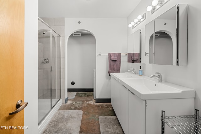 bathroom with vanity, concrete floors, and walk in shower