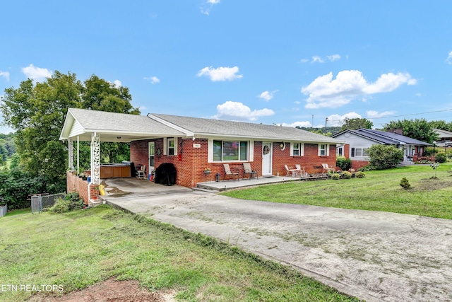 ranch-style home with a front yard and a carport