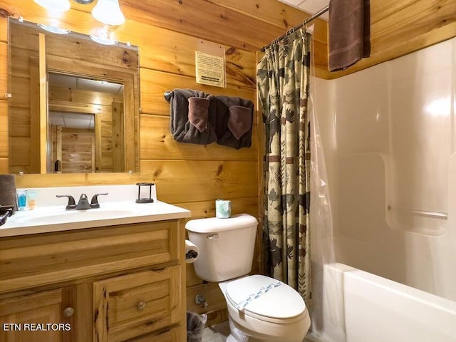 full bathroom with vanity, toilet, shower / bath combo, and wood walls