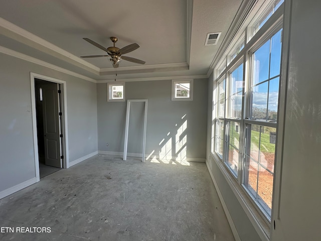 unfurnished room featuring a wealth of natural light, ceiling fan, and crown molding