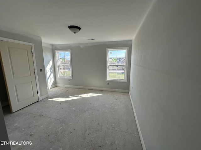 unfurnished room with a healthy amount of sunlight