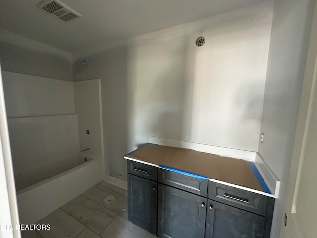 bathroom featuring bathtub / shower combination and vanity