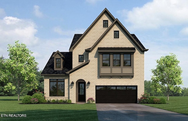 view of front of home featuring a front yard and a garage