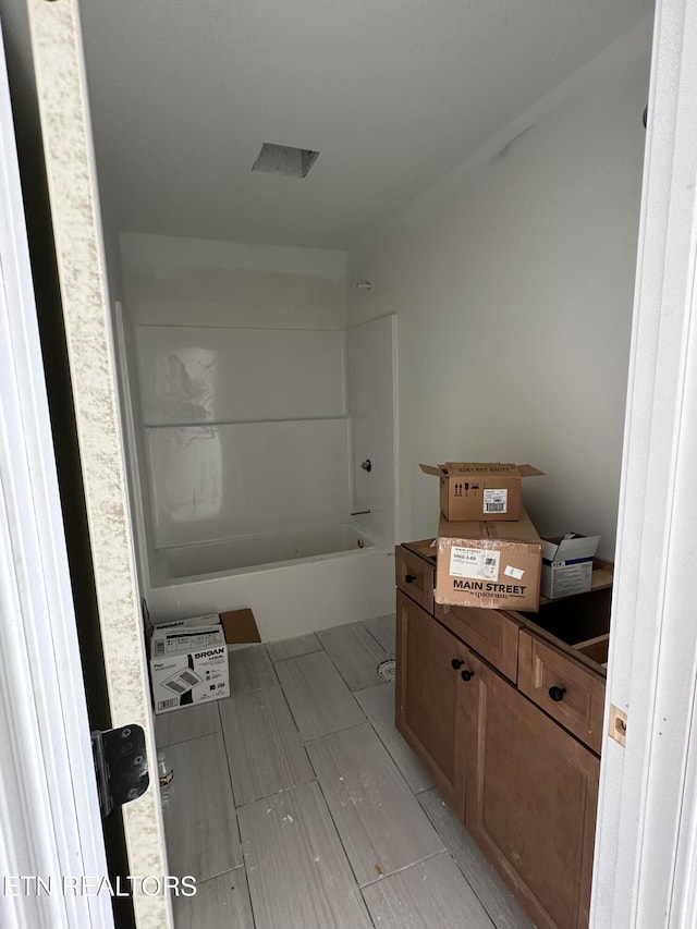 bathroom featuring washtub / shower combination