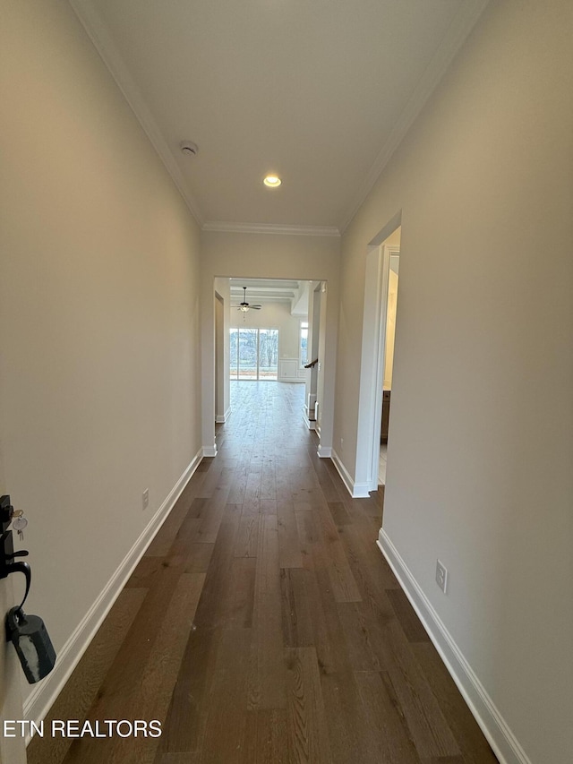 corridor with crown molding, recessed lighting, dark wood finished floors, and baseboards