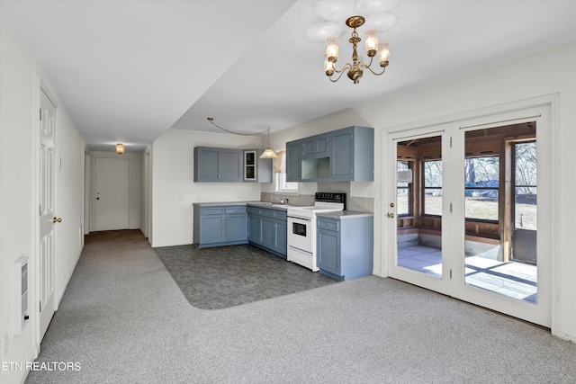 kitchen featuring blue cabinets, dark carpet, and white electric range oven