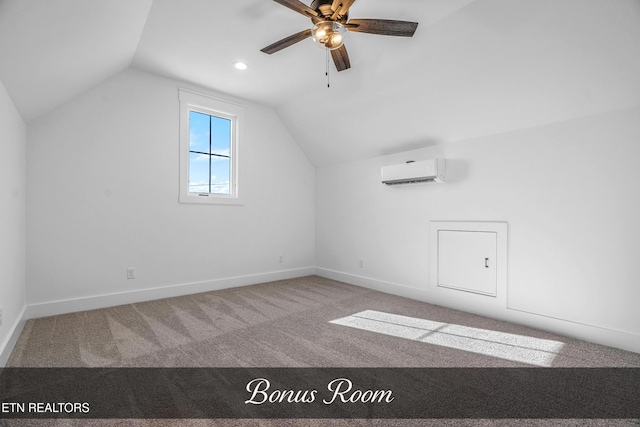 additional living space with an AC wall unit, ceiling fan, vaulted ceiling, and carpet flooring