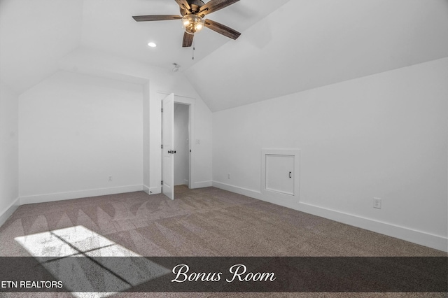 bonus room with lofted ceiling, ceiling fan, and carpet flooring