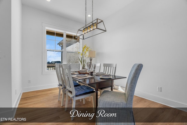 dining area featuring wood-type flooring