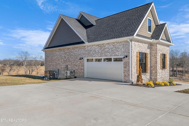 view of property exterior featuring a garage and central AC