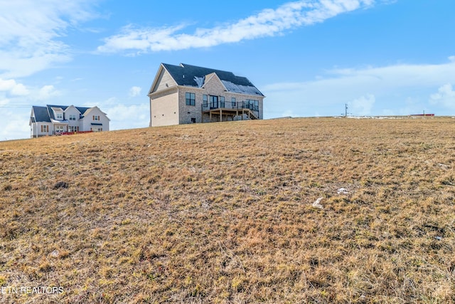 view of yard with a rural view